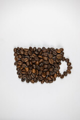 a cup made of coffee beans on a white backgrund