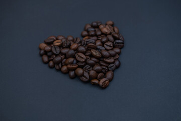 valentines heart made of coffee beans on a dark background