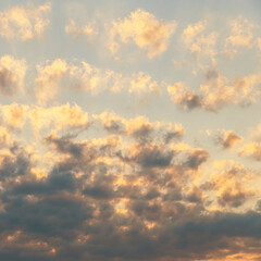 Beautiful sunlit golden clouds in the evening sky