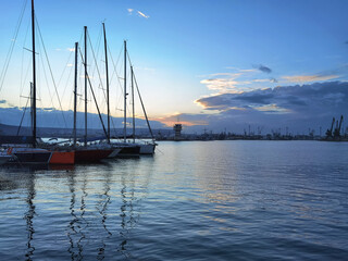 Yachts and boats at sunset in the harbor. Black sea, Varna, Bulgaria.