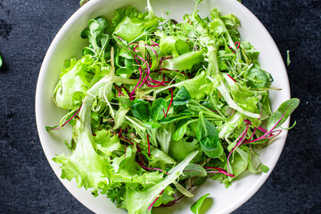 fresh green salad lettuce mix juicy microgreens snack ready to eat on the table healthy meal snack top view copy space for text food background rustic image keto or paleo diet