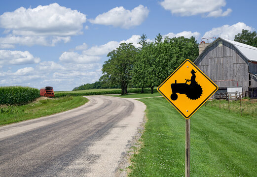 Farm Equipment Caution Sign:  A sign in southern Wisconsin alerts motorists to watch for farm machinery on the road ahead.
