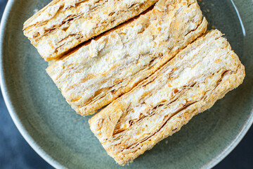 sweet cake napoleon puff pastry millefeuille butter cream dessert piece portion ready eat plate on...