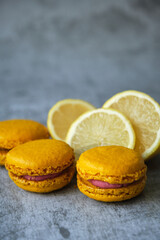 yellow lemon macaroni cookies on a gray background
