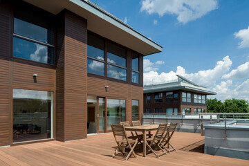 Spacious wooden terrace in modern building