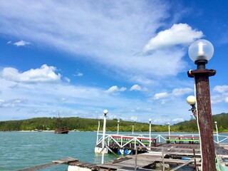 The landscape of the sea, the beautiful sky with many shapes of could, clearly mangrove sea, forest, a part of the floating restaurant fish cage, shows local lifestyle in Phuket Thailand.