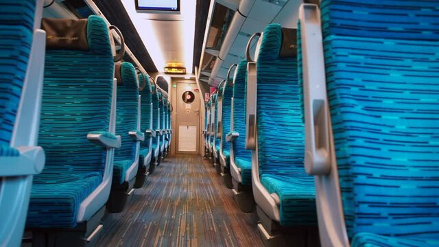 Empty seats in the transit car. Public transport movement along the route. Viral infection quarantine. The interior of the carriage.