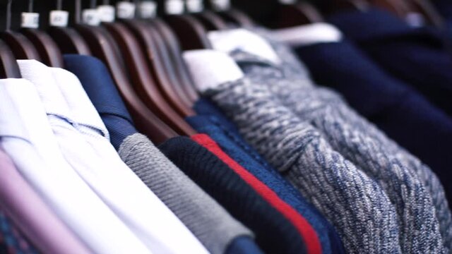 Various types of shirt for men on hanger. The solution for most men is an education in fabrics. Research on the influence of fabric color and quality properties on mens suits. 