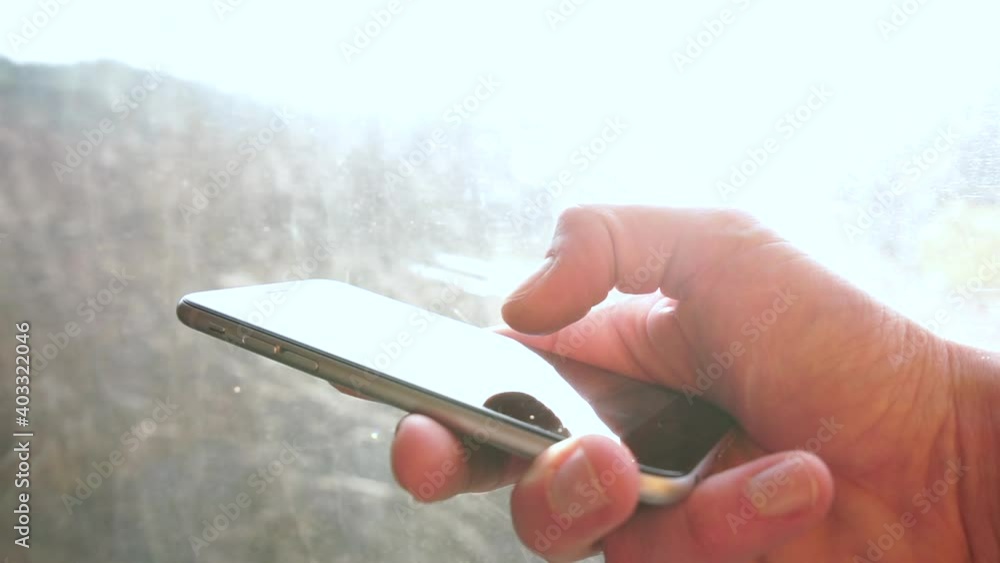 Poster the finger scrolls screen. transfer of information in the messenger using the mobile internet. high 