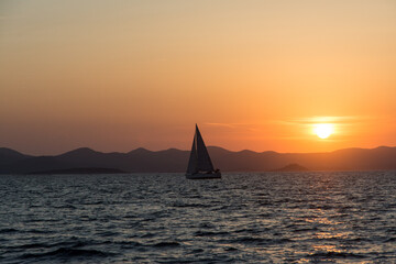 Obraz na płótnie Canvas view of a sailing yacht at sunset, Croatia