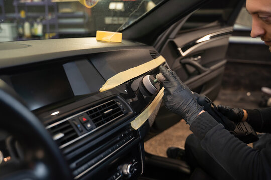 Professional polishing car interior trim. Auto detailing concept