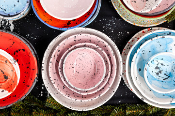 Some olorful craft ceramic or pottery plates, above view