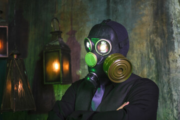 cosplay of a guy in a gas mask on a green background with glowing eyes