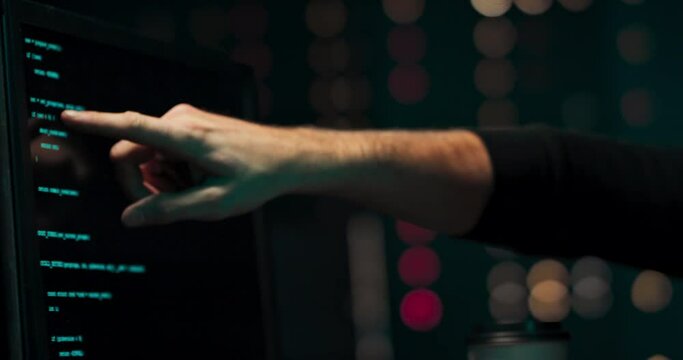 A close-up portrait of two hackers analyzing the code of malware that they will use to steal secret data from a government system.