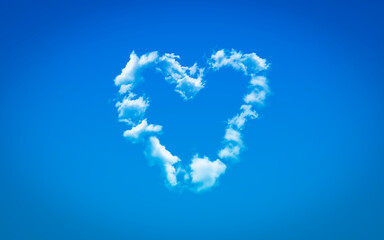 A white heart shape cloud as love symbol isolated in blue sky for Valentine's Day