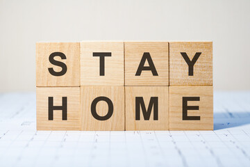 stay home written on a wooden cube