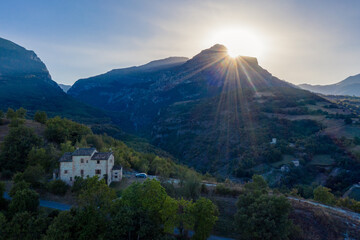 Typical Italian villa on the hills near Amandola, Marche region, Italy. Scenic countryside landscape during a beautiful sunset