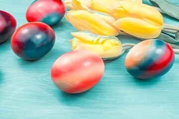 Easter decorations background . yellow tulips easter egg