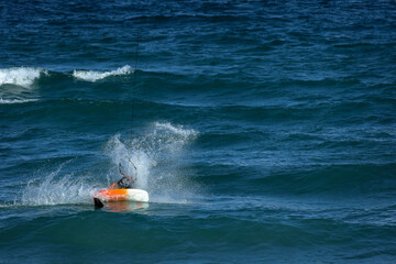 Kite surfing on a windy day offshore in Juno Beach Florida.