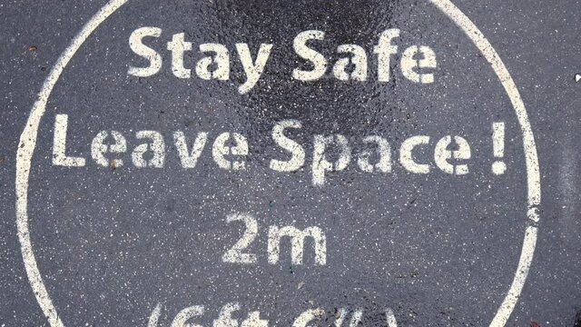Stay Safe Leave Space 2m (6ft 6') outdoors street warning alert in Pandemic. Coronavirus COVID-19 guidance on the roads text message for all people, practicing social distancing.