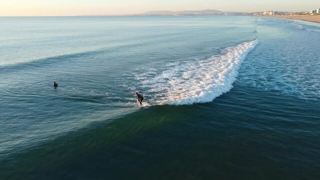 Surfer failed takeoff in Costa da Caparica beach, Portugal