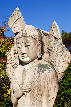 This ancient standing stone Buddha image is situated on the grounds of the Gyeongju National Museum in Gyeongju, South Korea.