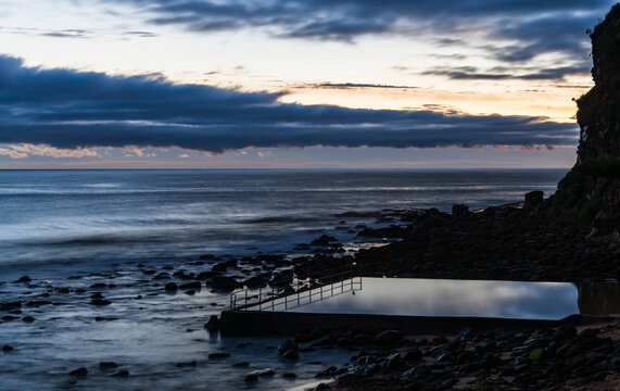 Clouds, Sea Pool, Photographer And A Dawn Seascape