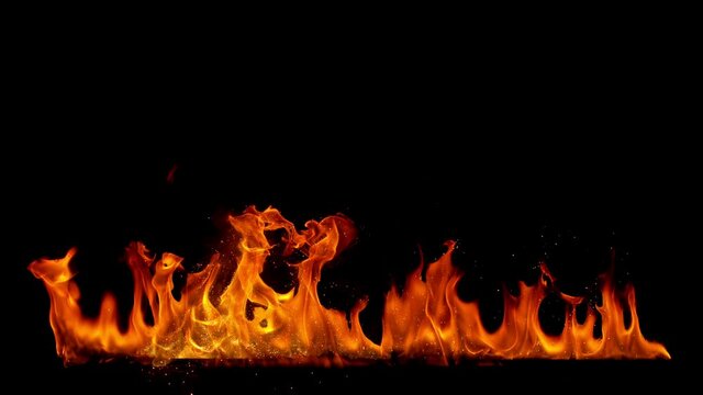 Super slow motion of fire line isolated on black background. Filmed on high speed cinema camera