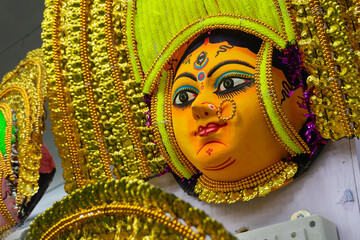 Colorful chhou masks of Hindu Goddess Durga, on display for sale at handicrafts fair, Kolkata, West...