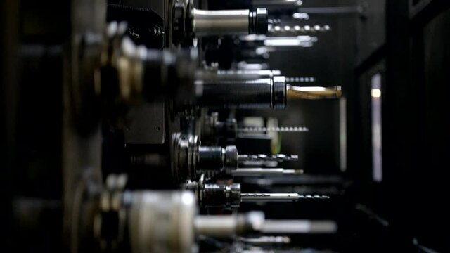 Tripod shot of an automated warehouse full of mechanical cnc tools