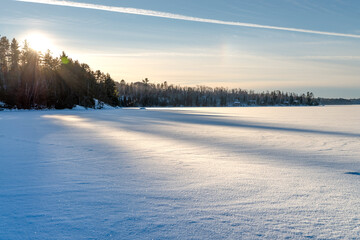 Frozen lake surface covered with snow