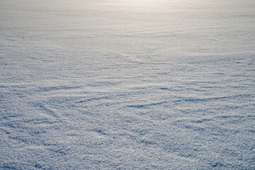 Frozen lake surface covered with snow background