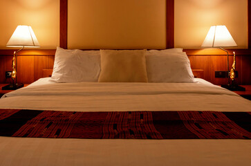 pillows and blanket in bed at night