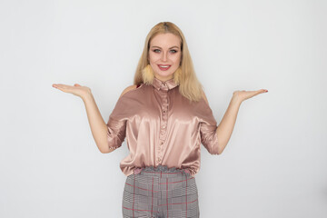 Smiling blonde business woman in pink blouse