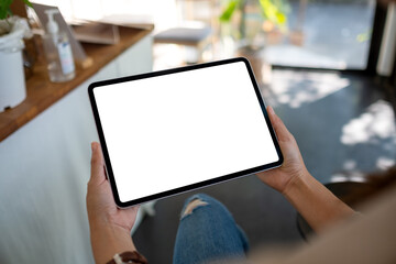 Mockup image of a woman holding digital tablet with blank white desktop screen