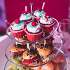 Beautifully decorated catering banquet table with variety of snacks and appetizers in new year christmas setting and on christmas new year celebration