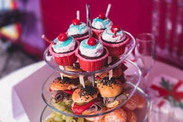 Beautifully decorated catering banquet table with variety of snacks and appetizers in new year christmas setting and on christmas new year celebration