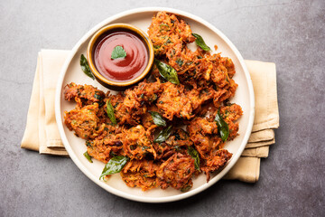 Tasty Gajar ke pakore or pakode also known as Carrot Fritters