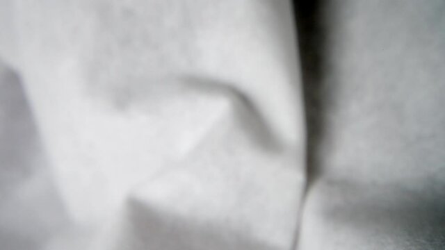 Pull back shot of white paper facial tissue close up