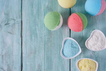 bath bombs and milk on turquoise surface