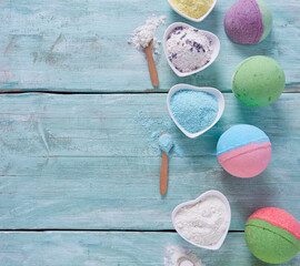 bath bombs and milk on turquoise surface