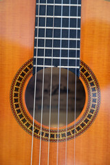 Obraz premium Closeup of beautiful guitar with signs of wear and use