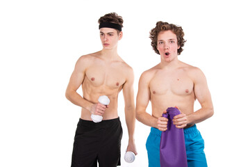 Fototapeta na wymiar Fitness and healthy lifestyle. Two young attractive students in the gym. White background. 