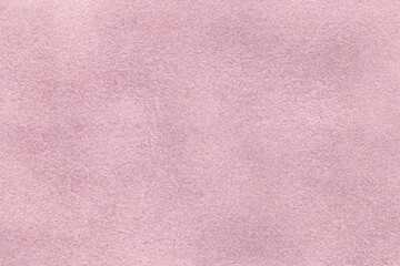 Light lilac matte background of suede fabric, closeup. Velvet texture of textile