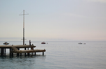 Fototapeta premium calm at sea in the first rays of the sun