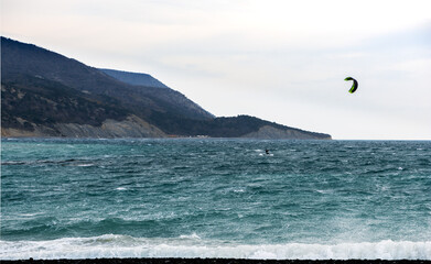 Fototapeta na wymiar Windsurfing with man on the Black Sea