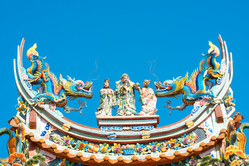 Chinese traditional temple roofs .bright multi-colored sculptures of Chinese god on the roof
