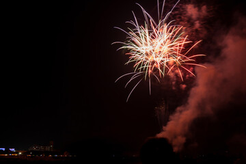 Colorful fireworks of various colors over night sky