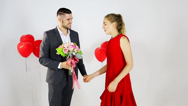Caucasian couple on prom date is happily dancing together for anniversary and valentine lover concept 