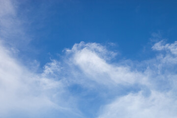 nature background., white clouds over blue sky soft focus.